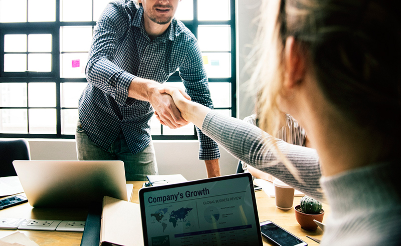 Shaking hands at business meeting